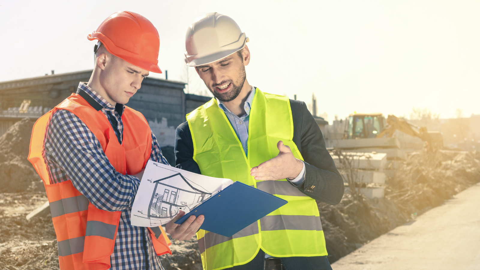 Technology contractor reviewing plans and cabling during a quick-service restaurant construction project